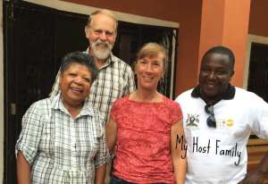 travel nurse with her host family in madagascar