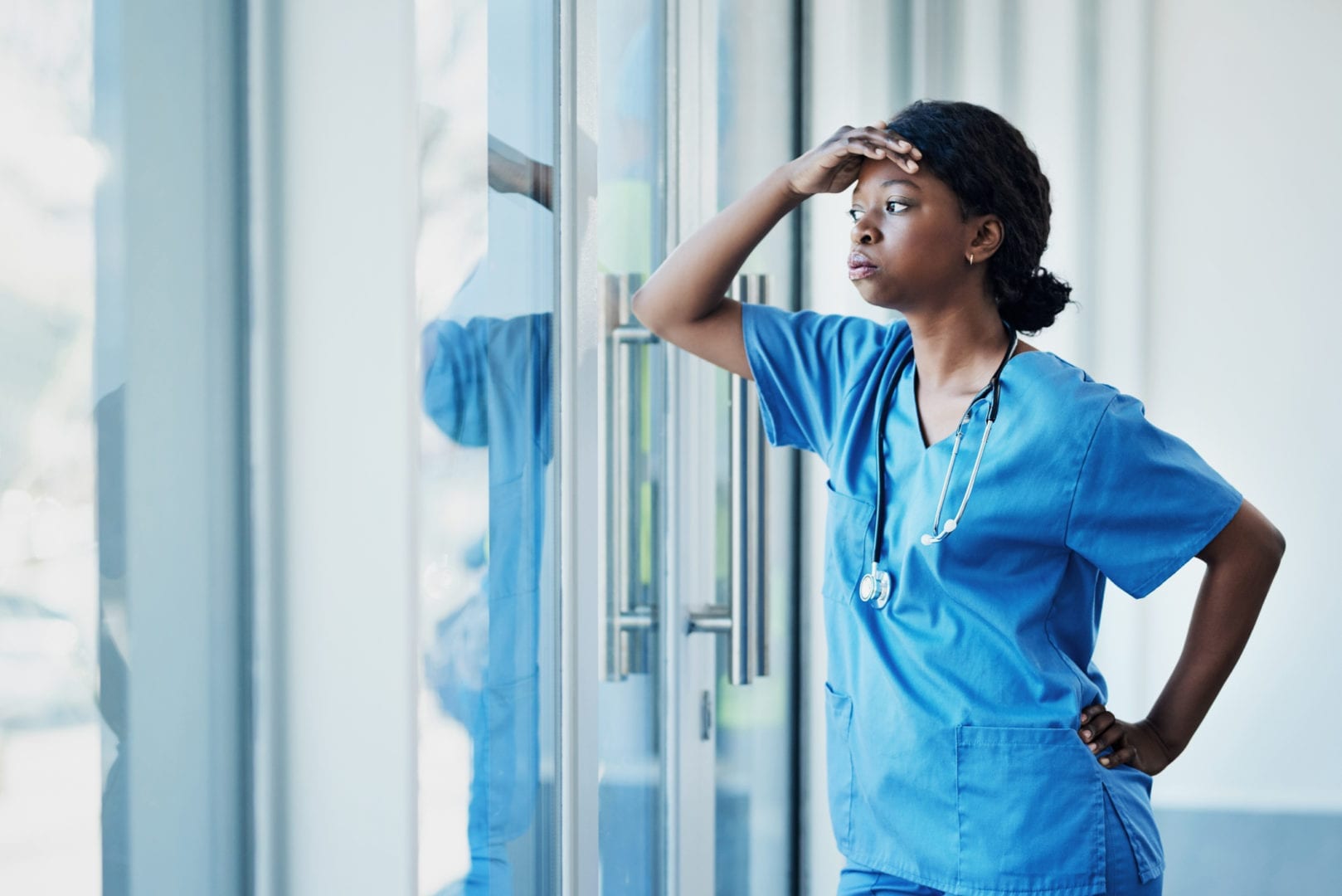 Tips and Resources to Prevent Nurse Burnout and Overcome Stress travel nurse dealing with stress from shift