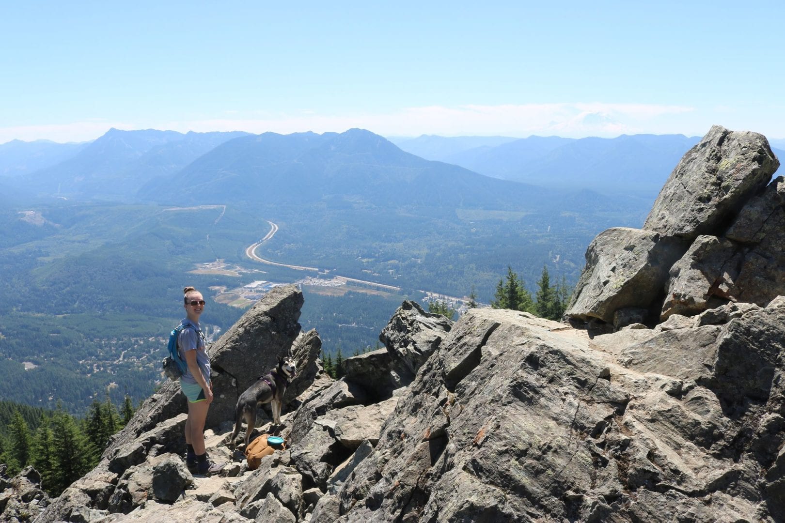 The Health Care Traveler Guide: Dog-Friendly Hikes in the PNW travel nurse with her dog on a trail in the pacific northwest