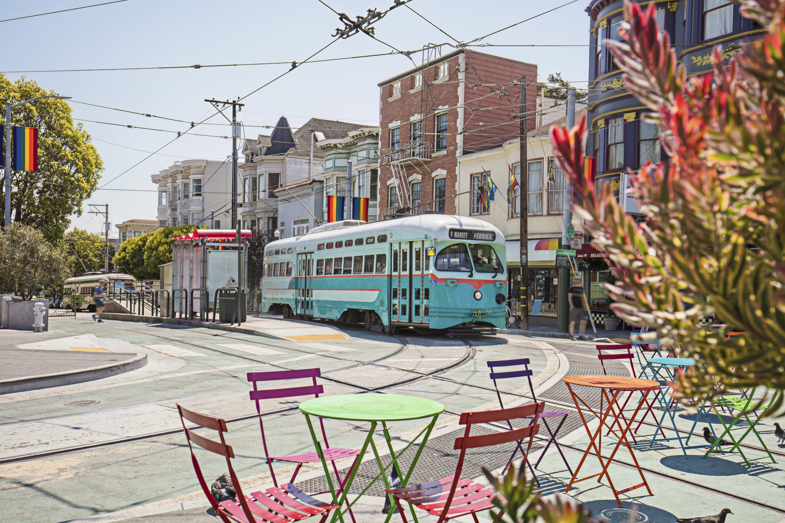 Vibrant LGBTQ-Friendly Cities for Travel Assignments Streetcar in San Francisco’s Castro District with Pride flags, LGBTQ-friendly neighborhood with historic charm.