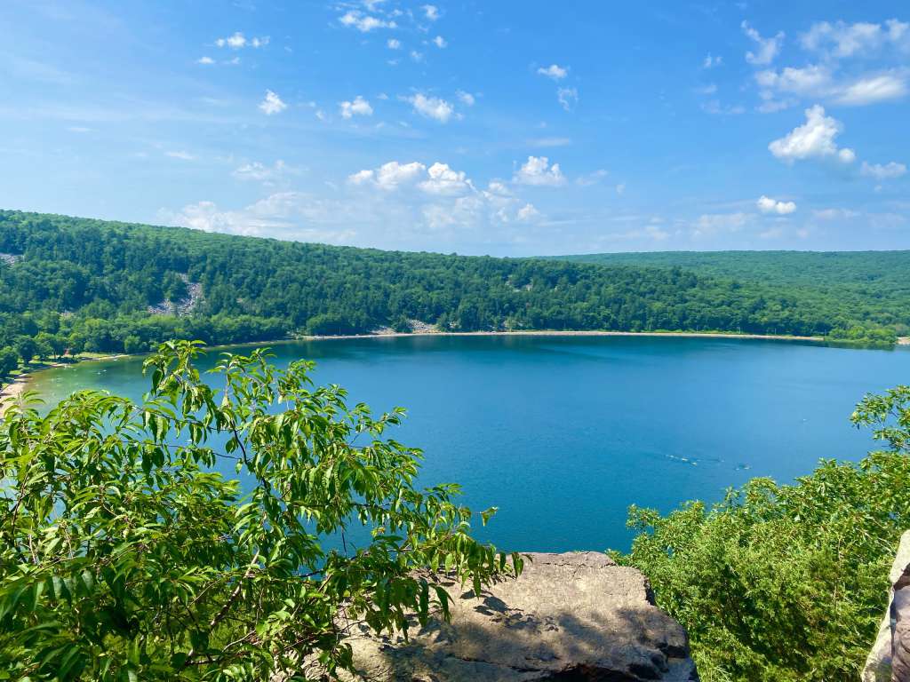 Devil’s Lake surrounded by quartzite bluffs and forested hiking trails in Wisconsin on a clear summer day